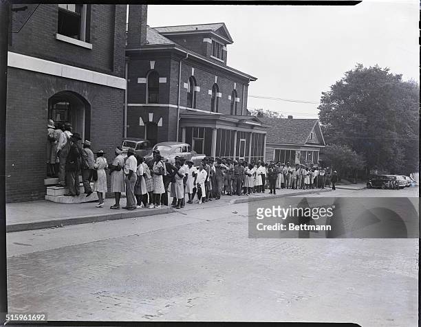 Black voters line up to vote in the Georgia Democratic primaries at Cobb County Courthouse, Marietta, GA, United States, 17th July 1946....