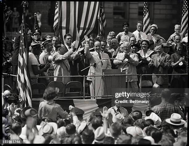 Detroit, Michigan- Governor Adlai Stevenson of Illinois waves to a Labor Day crowd during his speech in Detroit. In his speech, Governor Stevenson...