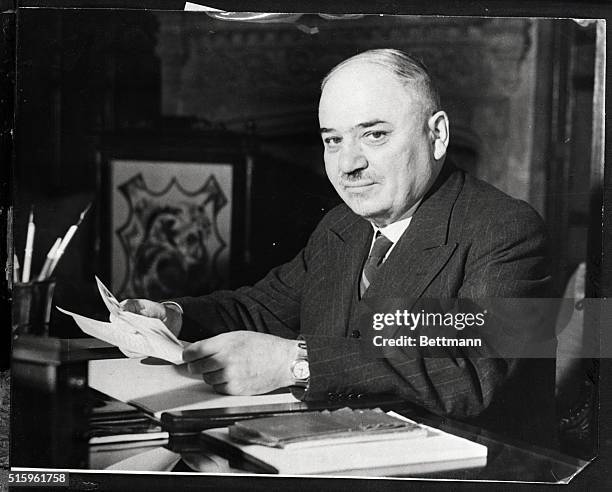 London, England-M. Maisky, Soviet ambassador to Britain, reads congrats on his award of Order of Lenin in London.