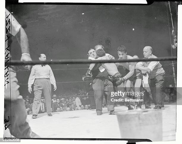 Graziano Wins on TKO. New York: Referee, handlers and opponent all join hands to carry the limp and unconscious form, of Freddie Cochrane to his...