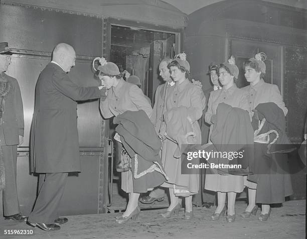 Bidding farewell to their host, Cardinal Spellman, Cecile Dionne kisses his ring as Papa, Yvonne, Marie, and Emily watch . High point of their...