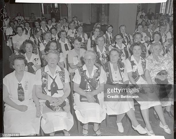 The Military order of Cooties, , is shown with the Cootiettes, , holding a meeting in the Hotel McAlpin.