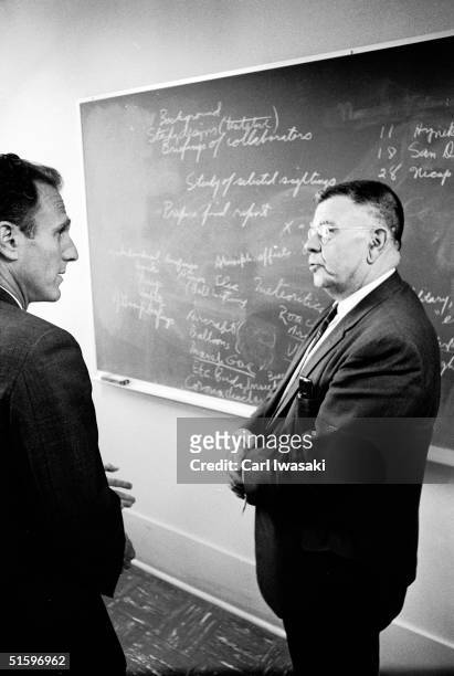 American physicist Edward U. Condon and Robert Low, special assistant to the vice president and dean of faculties at the University of Colorado,...