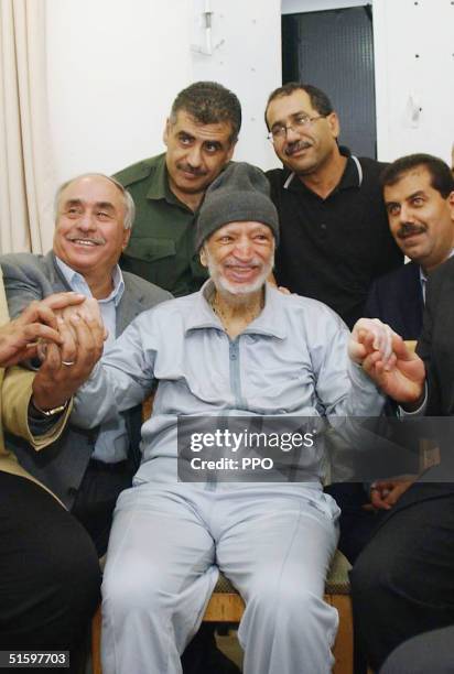 In this handout picture from the Palesinian Press Office, Palestinian President Yasser Arafat sits with Jordanain, Egyptian and Tunisian medical...