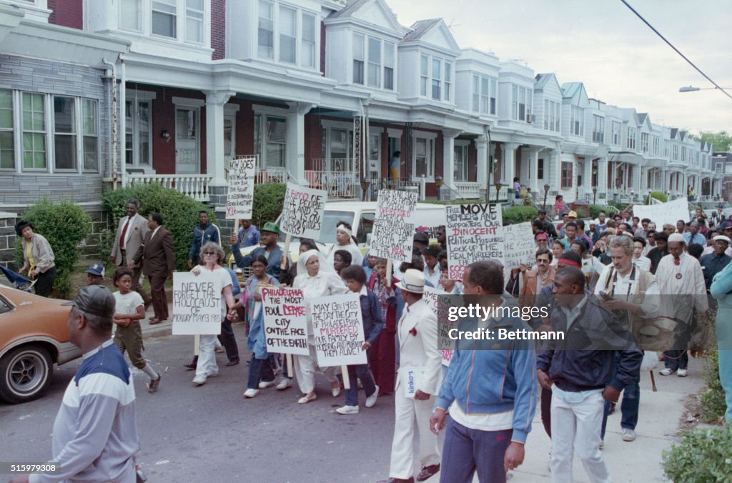 MOVE Protesters Holding Placards
