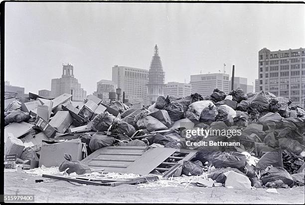 Philadelphia, PA- During day 12 of the municipal workers' strike, garbage accumulates at this temporary dump site, as City Hall looms in the...