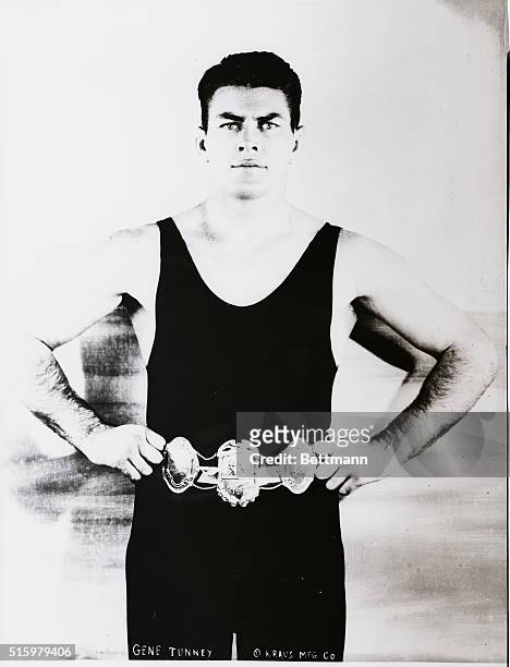 Gene Tunney displaying championship belt, 1926.