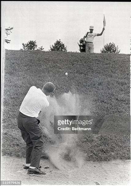 Balitmore, MD- Deane Beman of U. S., comes out of sand trap on 4th hole of his singles match against Sandy Saddler, of England, in Walker Cup...