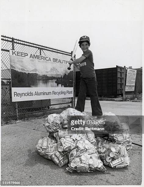 Los Angeles, California- Greg Glass Woodland Hills, goes to bat for Californias' environment after exchanging wagon-load of recyclable aluminum cans...