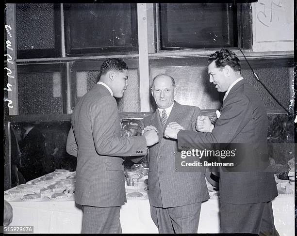 New York, NY- Joe Louis , sensational Detroit Negro heavyweight, is squaring off with Jack Dempsey, the former champion, as Mike Jacobs, promoter,...