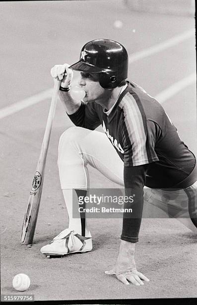 Houston, TX-Houston Astros starting pitcher in game 2 of the National League Playoff, Nolan Ryan waits his turn in pre-game batting practice, blowing...