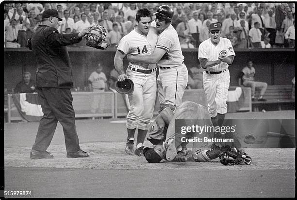 Cincinnati, OH- Cleveland Indians catcher Ray Fosse lies on the ground after his 12th inning collision with Cincinnati Reds' Pete Rose, No. 14....