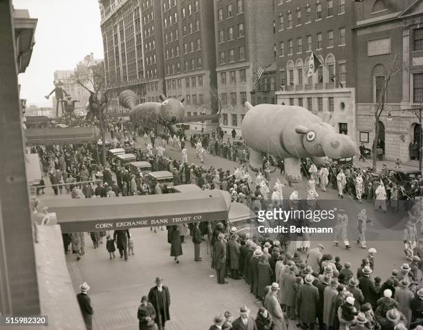 New York: View of Macy's Thanksgiving Day Parade on Broadway. Image foregrounds giant hippopotamus balloon.