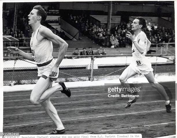 Bannister is shown winning the one mile final from H.J. Parlett in the University Athletic Union Championships at White City, England, 1949....