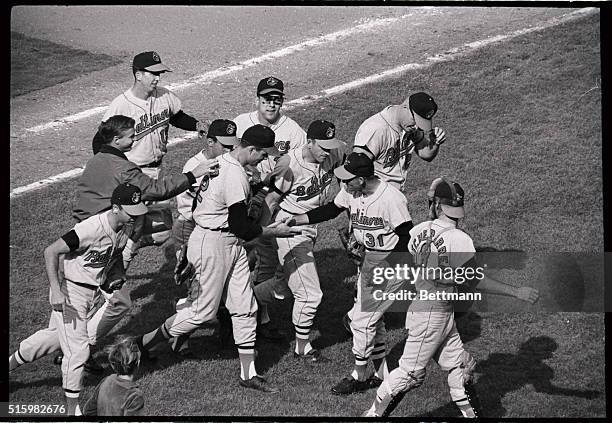 Los Angeles, CA: Baltimore pitcher Jim Palmer is mobbed by teammates following his 4-hit shutout in the second game of the World Series. Among the...