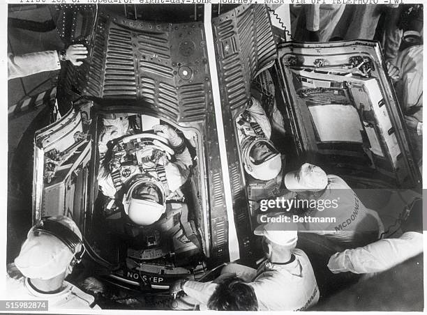 Cape Kennedy, FL-Astronauts Gordon Cooper and Charles Conrad lie on their backs in their Gemini-5 spacecraft atop the nose of a Titan-11 rocket as...