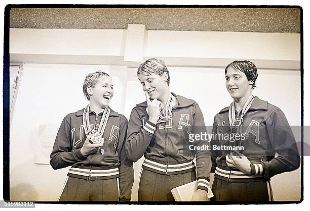 Tokyo, Japan -: Three American girls stand on the winners platform after receiving their medals for winning in the woman's 400 meter individial...