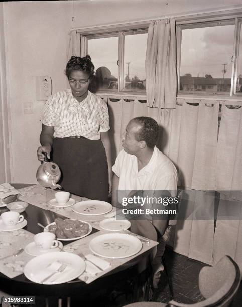 William Myers Jr and his wife Daisy have tea in their new house in the Dogwood Hollow section of Levittown, Pennsylvania, USA, 19th August 1957....