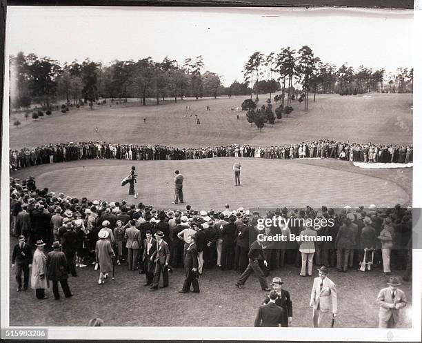 Augusta, GA- Ralph Guldahl is shown putting on the ninth green of the final round, as he carded the 72-hole total of 279 to win the annual Masters'...