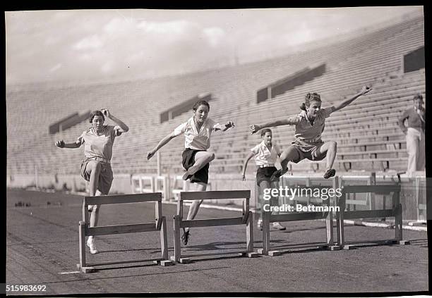 Lawrence, KS- Camilla Luther winning the 50-yard low hurdle race in the recent University of Kansas girls track meet. The victor also won two dash...