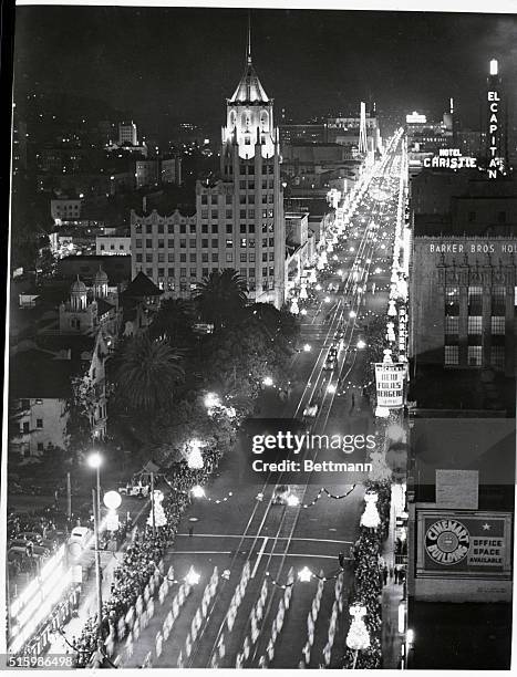 The annual Santa Claus Lane Parade marches down a brightly lit Hollywood Boulevard in Hollywood, California. | View from: Hollywood Roosevelt Hotel.