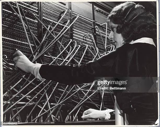 Female telephone operator handling New York calls. Undated photograph.