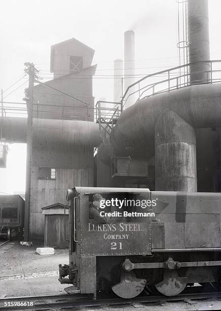 Coatsville, Pennylvania. Lukens Steel Co.- Scene in the steel yard. Man in train car.