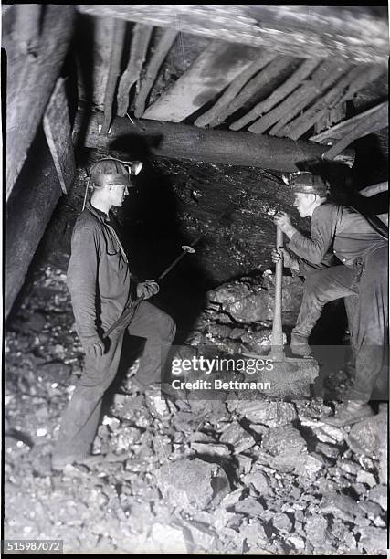 Anthracite coal mining near Pottsville, Pennsylvania. Photo shows miners at the Maple Hill Colliery loosening the top of a vein after a blast....