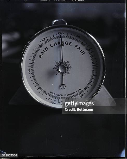 Photo shows a weather barometer. Undated.