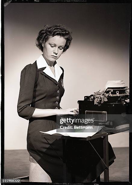 Photo shows a young woman stenographer. Model: Shirley Fletcher. Ca. 1940s.