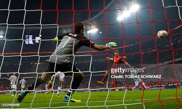 Juventus' goalkeeper from Italy Gianluigi Buffon fails to save a shot from Bayern Munich's midfielder Thomas Mueller during the UEFA Champions...