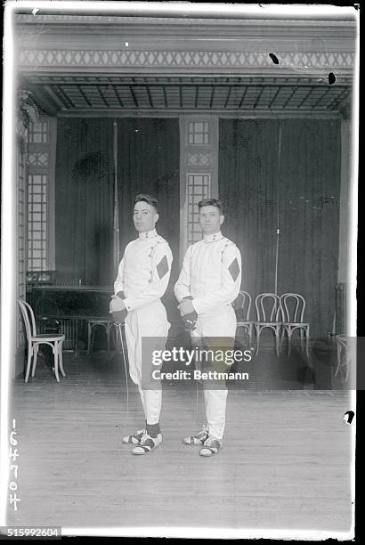 Intercollegiate fencers at hotel Astor, N.Y. Walter Scott Ginn, and Daniel Stubbs, members of the U.S. Naval Academy at the Intercollegiate Fencing...