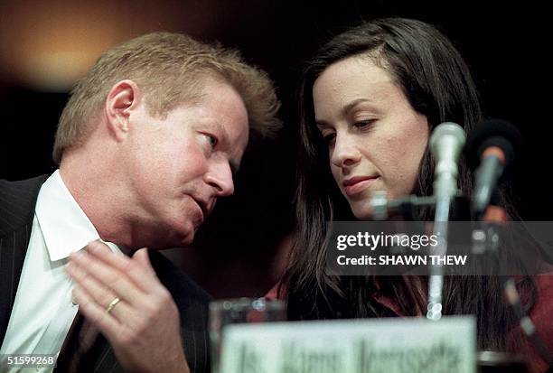 Musician Don Henley and singer Alanis Morissette confer during US Senate Judiciary hearings 03 April 2001 on Capitol Hill in Washington, DC. The...