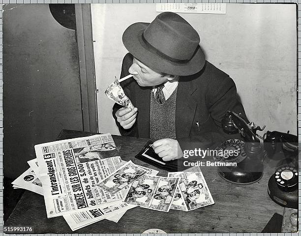 France- The 5,000 notes have no more value, and our picture shows a man who prefers to light his cigarette with one of them that declare them to the...