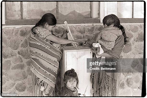 Comalapa, Guatemala- Children with them, Guatemalan Indian women cast ballots in the March 7 general election at a polling place in Comapala, some 30...