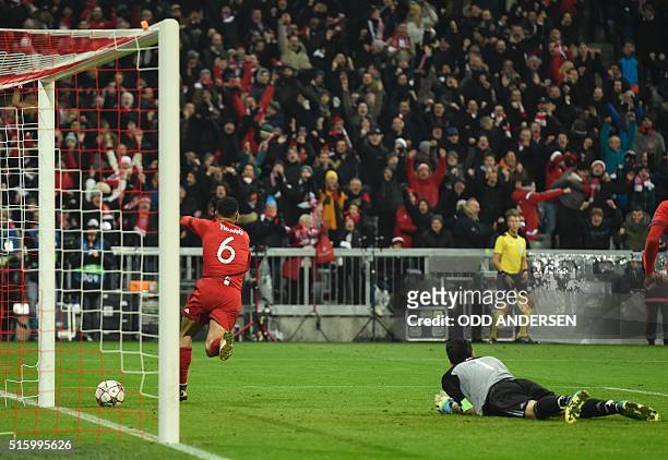Bayern Munich's Spanish midfielder Thiago Alcantara scoring past Juventus' goalkeeper from Italy Gianluigi Buffon during extra time during the UEFA...