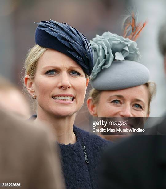 Zara Phillips and Dolly Maude watch the Queen Mother Champion Chase as they attend day 2, Ladies Day, of the Cheltenham Festival on March 16, 2016 in...