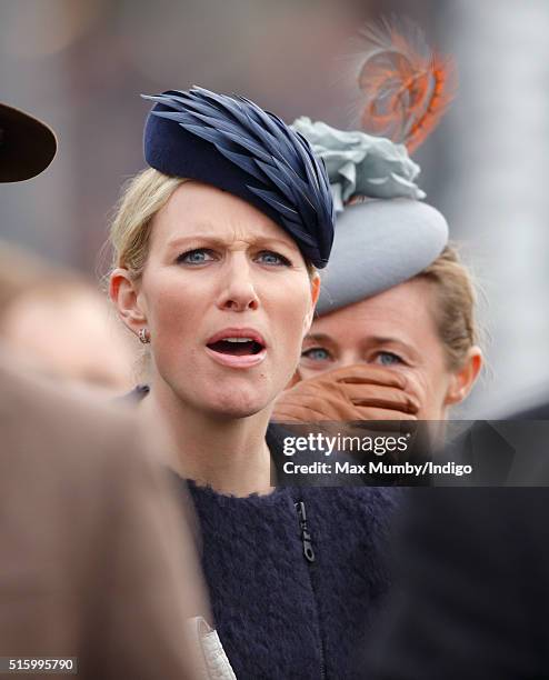 Zara Phillips and Dolly Maude watch the Queen Mother Champion Chase as they attend day 2, Ladies Day, of the Cheltenham Festival on March 16, 2016 in...