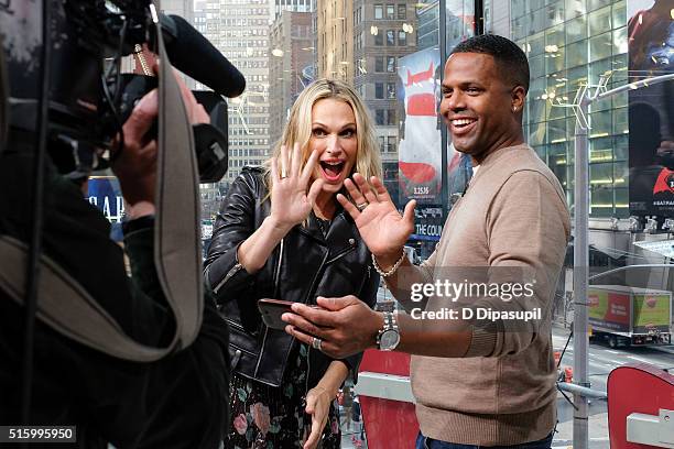 Calloway interviews Molly Sims during her visit to "Extra" at their New York studios at H&M in Times Square on March 15, 2016 in New York City.