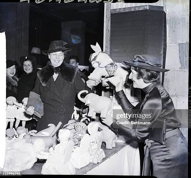 New York, New York- Mrs. Franklin D. Roosevelt, visiting the fifteenth annual Christmas sale of articles made by the blind, conducted by the New York...