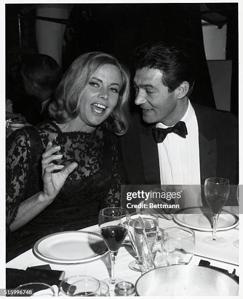 British actress Honor Blackman gets rapt attention from her business executive husband, Maurice Kauffman, which figures well for romance and...