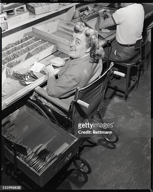 West Hempstead, Long Island, New York: Wheelchair-bound woman working at Abilities, Inc., a factory that employs disabled workers.