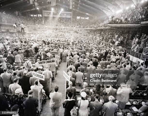 Chicago, IL-: Delegates stand in Convention Hall as Samuel Cardinal Strich, Archbishop of Chicago, pronounces the invocation shortly after the 31st...