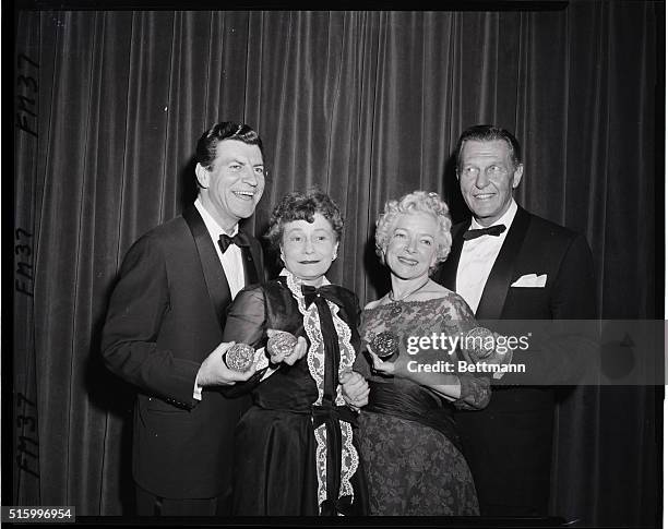 New York, NY- a happy foursome displays the "Tony" awards presented them at the twelfth annual dinner-dance of the American Theatre Wing in the...