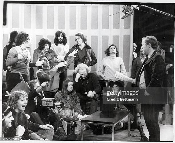 London, England- TV talk show moderator David Frost , tries to deal with a group of 20 Yippies who leapt to the stage to join Jerry Rubin, leader of...