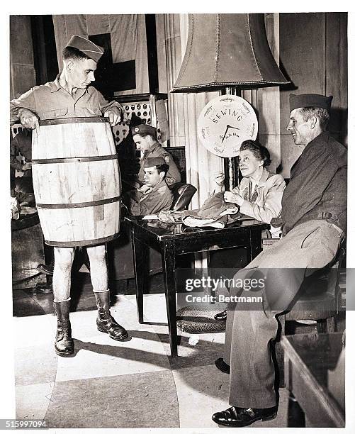 Paris, France- Paris does not have a wardrobe permitting two pairs of pants so here at the American Red Cross Club, "Rainbow Corners," they furninsh...