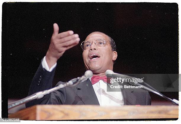 Photo shows Black Moslem leader Louis Farrakahn addressing a crowd.