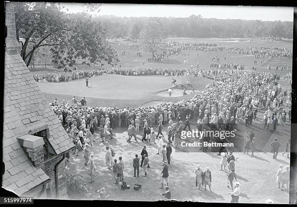 The final hole of the open golf championship...A general view of the vast crowd which watched Bobby Jones sink the final putt at the 18th hole in the...