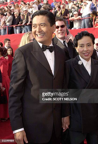 Actor Chow Yun Fat arrives with his wife Jasmine 25 March 2001, for the 73rd Annual Academy Awards in Los Angeles, CA. Chow Yun Fat stars in the...
