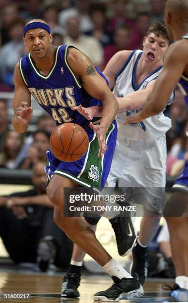 Orlando Magic guard Mike Miller knocks the ball from Milwaukee Bucks' forward Scott Williams during the first period at the TD Waterhouse Centre 16...